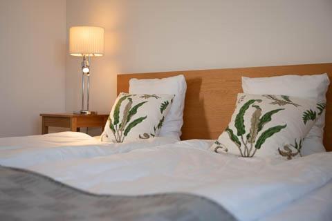 Postel nebo postele na pokoji v ubytování borgeby Slotts Hotell