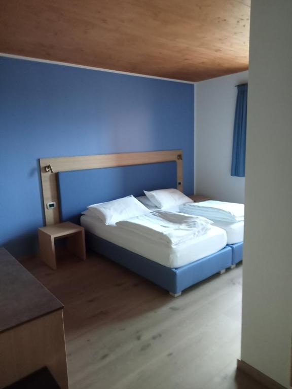 Voodi või voodid majutusasutuse Agritur I Colori toas
