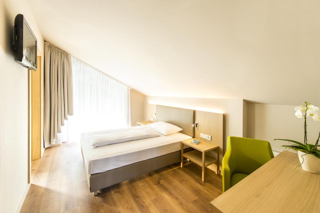 Postel nebo postele na pokoji v ubytování Hotel CampingPark Steiner