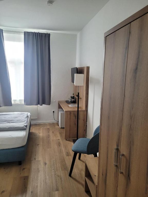 Postel nebo postele na pokoji v ubytování Hotel Haus Borkum
