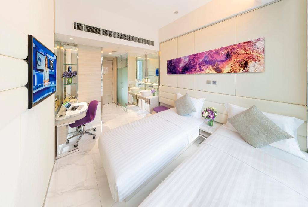 Postel nebo postele na pokoji v ubytování iclub Mong Kok Hotel