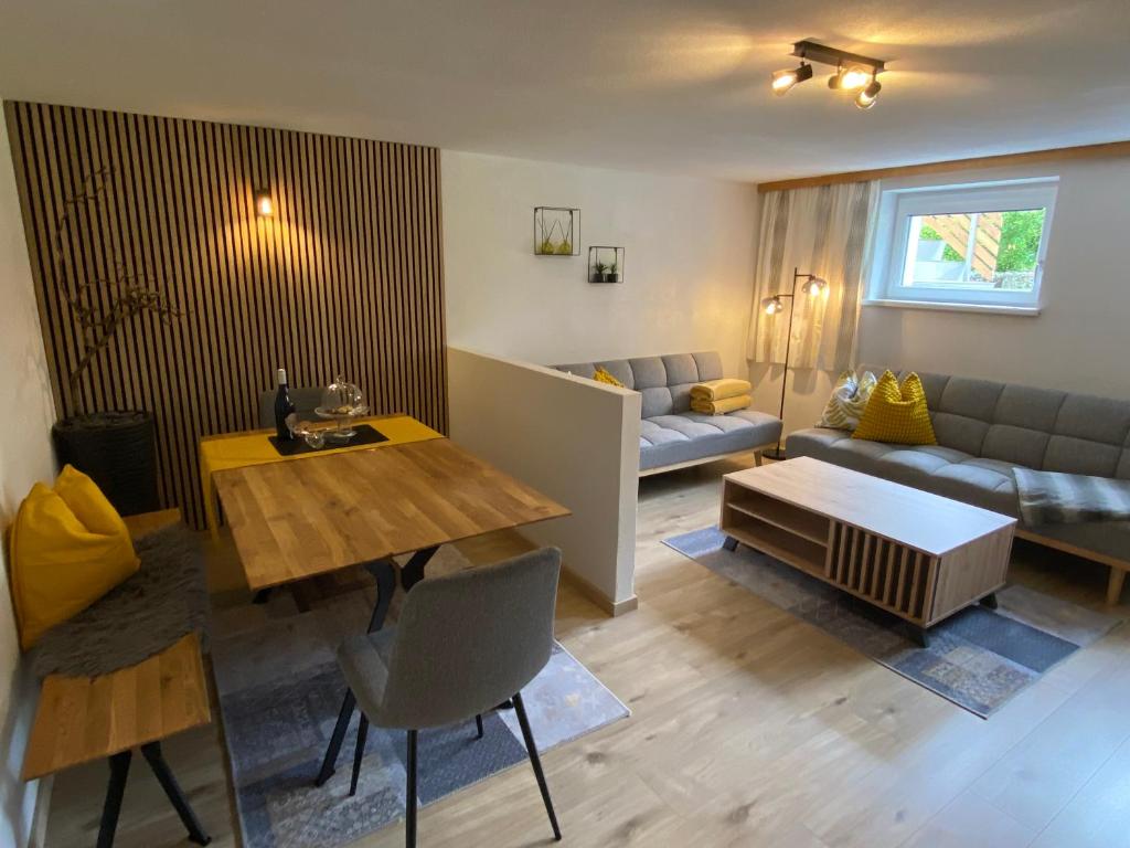 a living room with a table and a couch at Appartment Kapferer in Gries im Sellrain