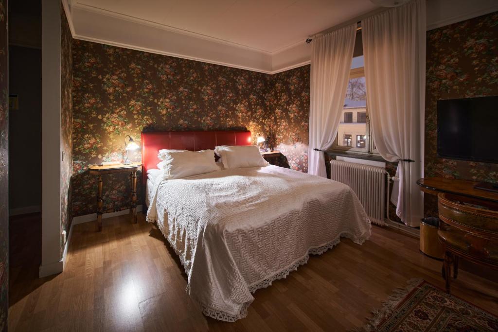 En eller flere senger på et rom på Hotell Läckö