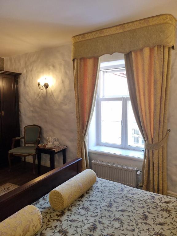 Voodi või voodid majutusasutuse Taanilinna Hotell toas