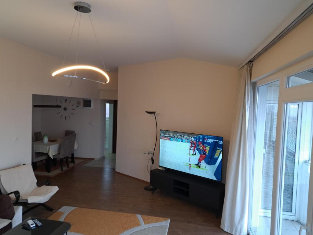 a living room with a flat screen tv in a living room at Skopje Panorama in Skopje