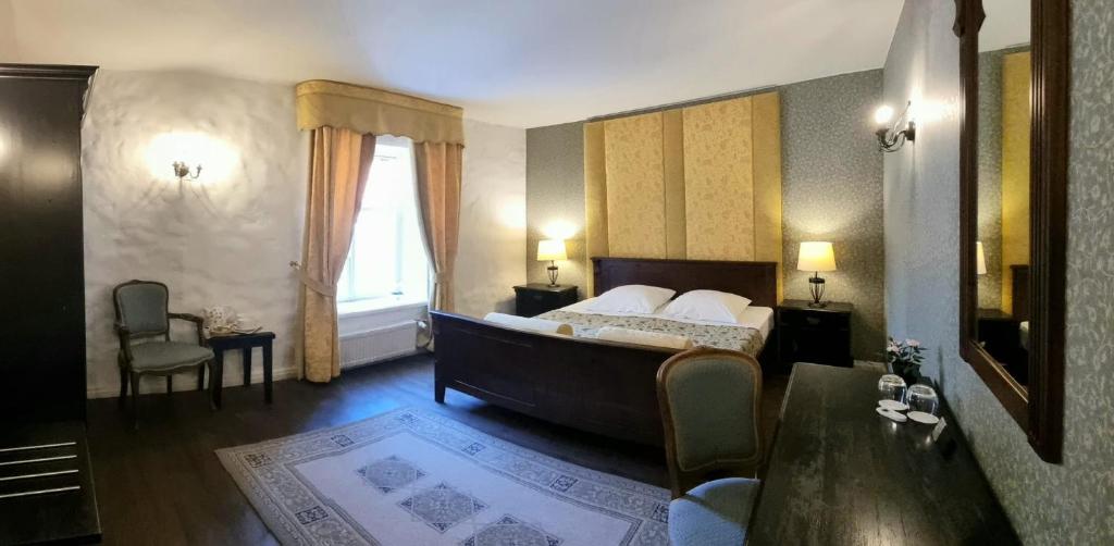 Voodi või voodid majutusasutuse Taanilinna Hotell toas