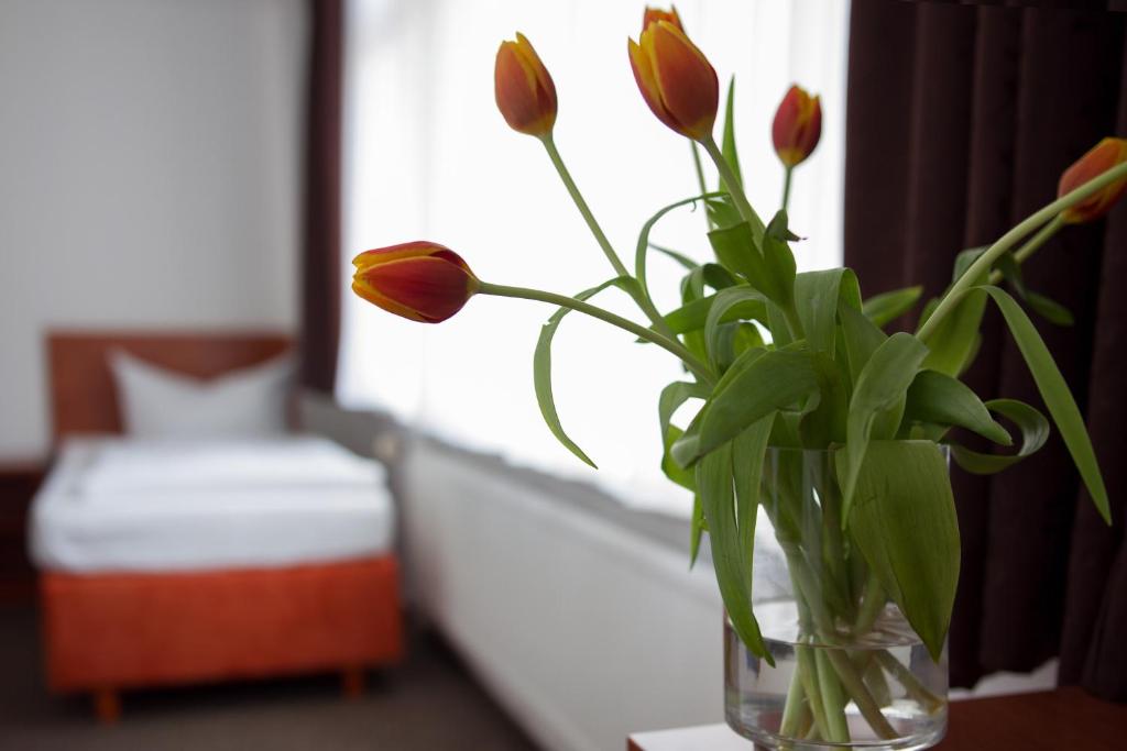 Postel nebo postele na pokoji v ubytování Hotel Eckstein