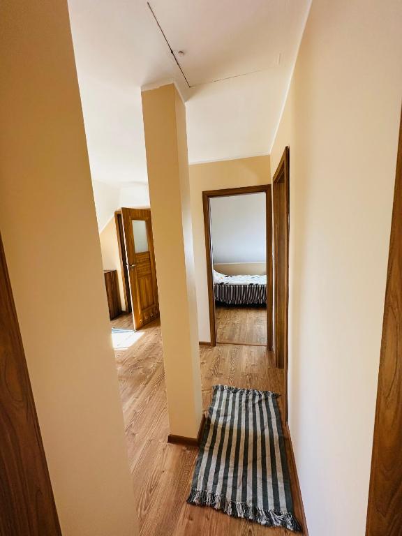Postel nebo postele na pokoji v ubytování Niebieska Chmurka