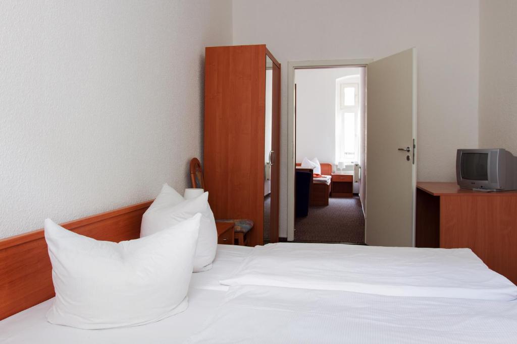 Postel nebo postele na pokoji v ubytování Hotel Eckstein