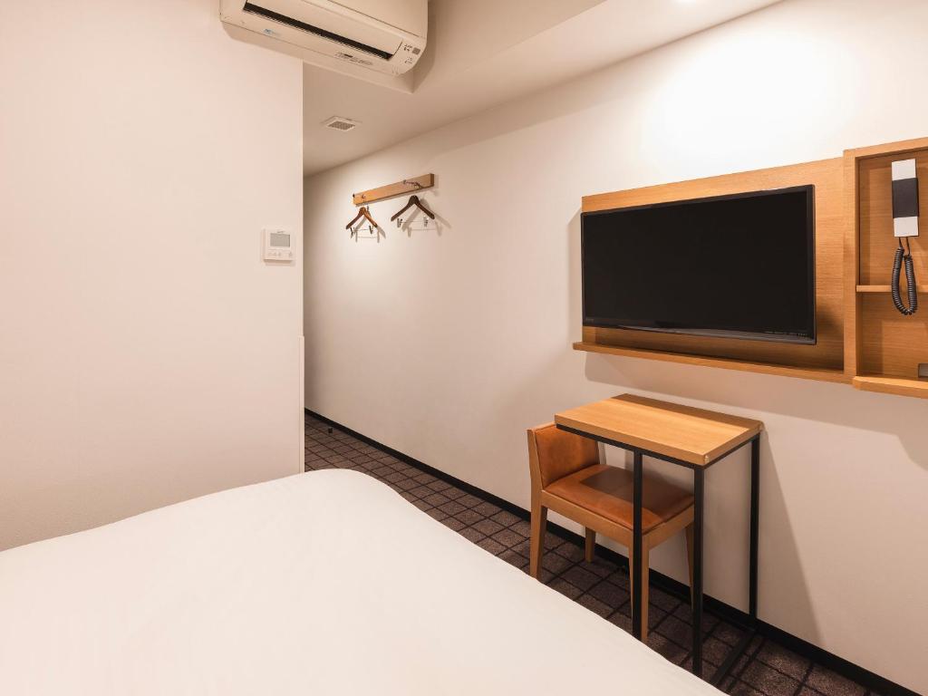 TV a/nebo společenská místnost v ubytování Sotetsu Fresa Inn Kobe Sannomiya