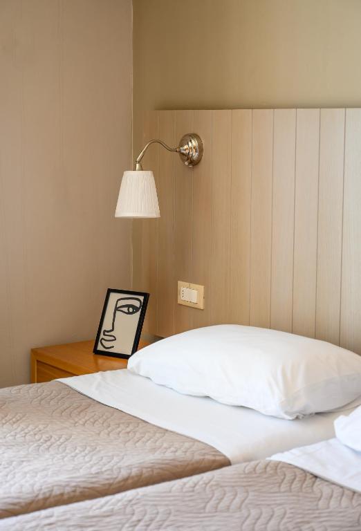 Postel nebo postele na pokoji v ubytování El Greco Hotel