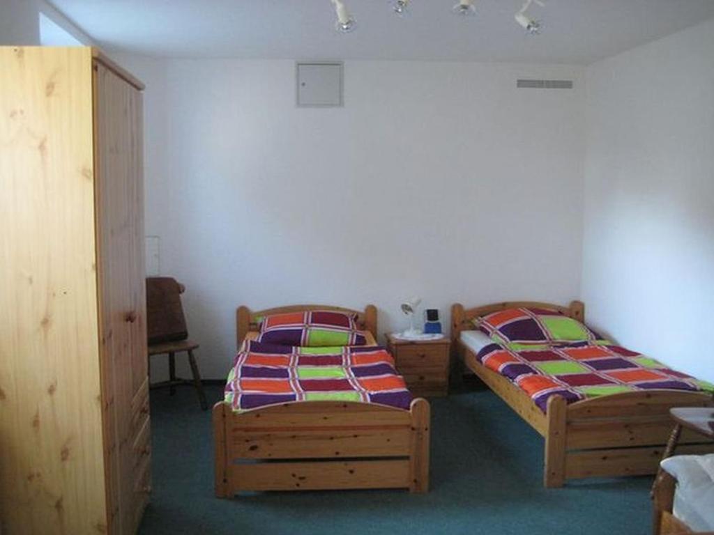 Voodi või voodid majutusasutuse Ferienwohnungen Heiliger See toas