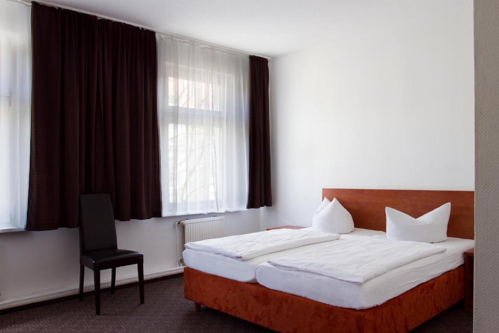Postel nebo postele na pokoji v ubytování Hotel Eckstein