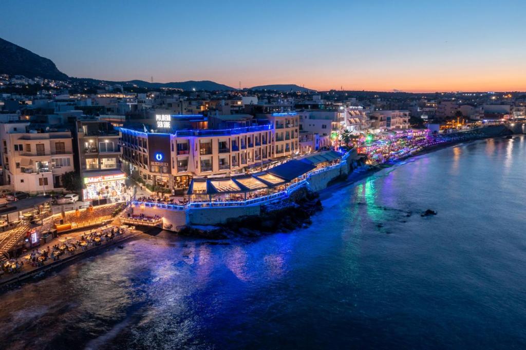 an aerial view of a city at night at Palmera Beach Hotel & Spa - Adults Only in Hersonissos