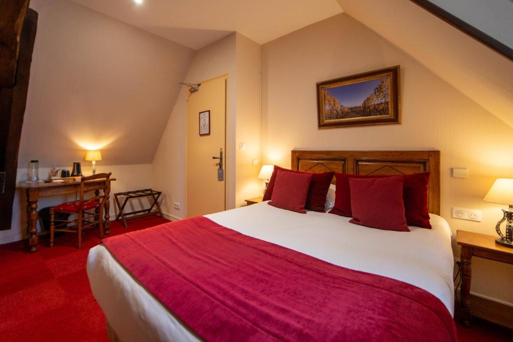 Postel nebo postele na pokoji v ubytování Hôtel Wilson - Teritoria