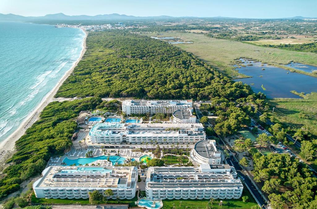 an aerial view of a resort next to the ocean at Iberostar Selection Albufera Playa All Inclusive in Playa de Muro