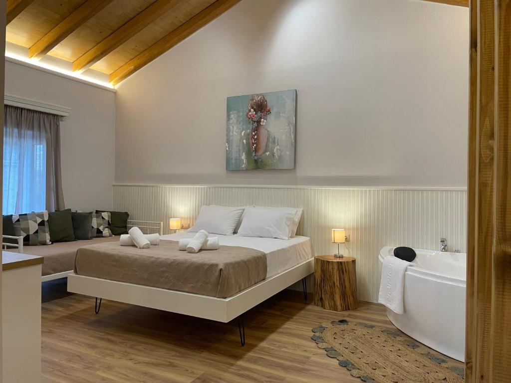Postel nebo postele na pokoji v ubytování Goninos Jacuzzi Suite