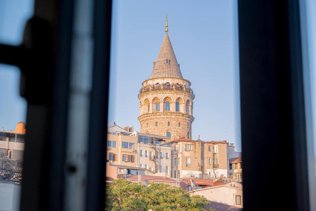 a view of a building with a tall tower at Galata Greenland Hotel in Istanbul