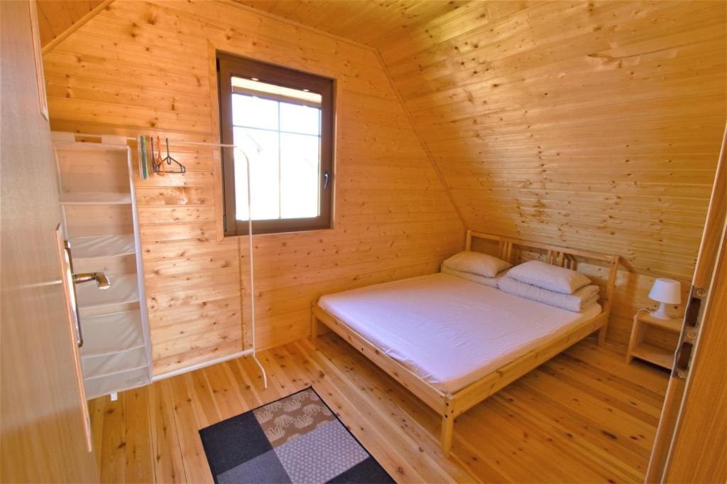 Postel nebo postele na pokoji v ubytování Domki LUX