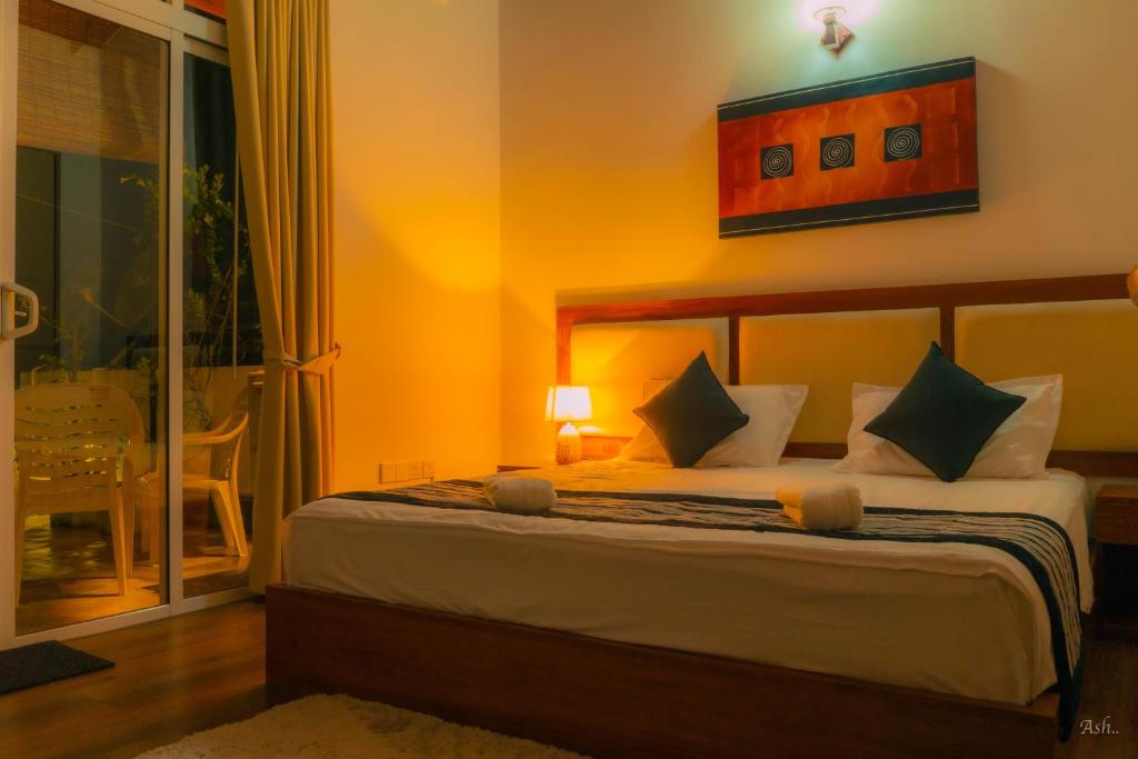 Postel nebo postele na pokoji v ubytování Amandara Hills Kandy
