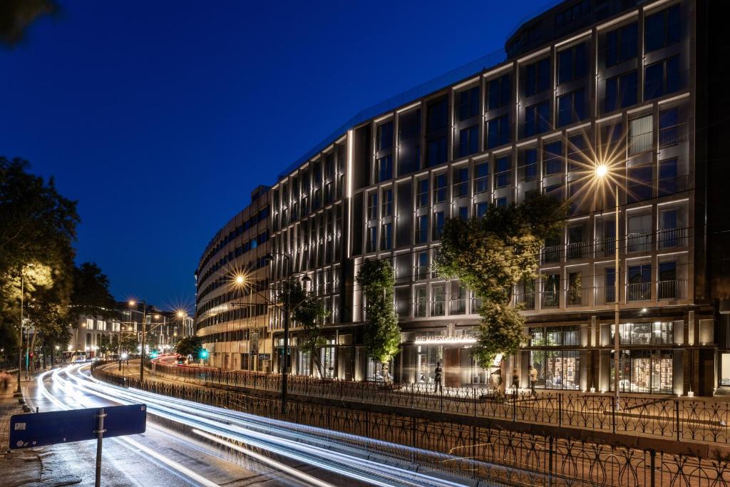 a building on a city street at night at The Maestro Hotel in Istanbul