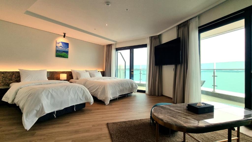 Postel nebo postele na pokoji v ubytování Hotel GITE