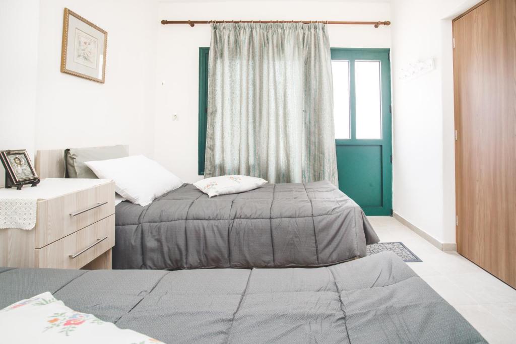 Postel nebo postele na pokoji v ubytování Froso's Home