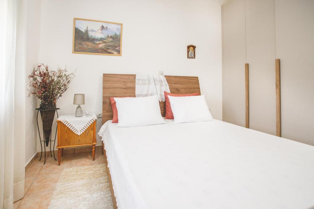 Postel nebo postele na pokoji v ubytování Froso's Home