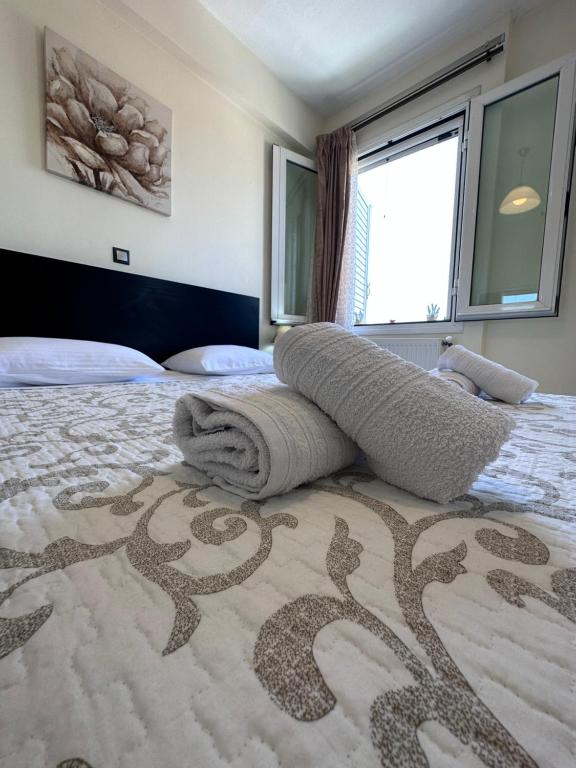 Postel nebo postele na pokoji v ubytování Olia apartment