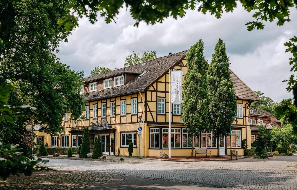 an old building in the center of a town at Niemeyers Romantik Posthotel in Faßberg