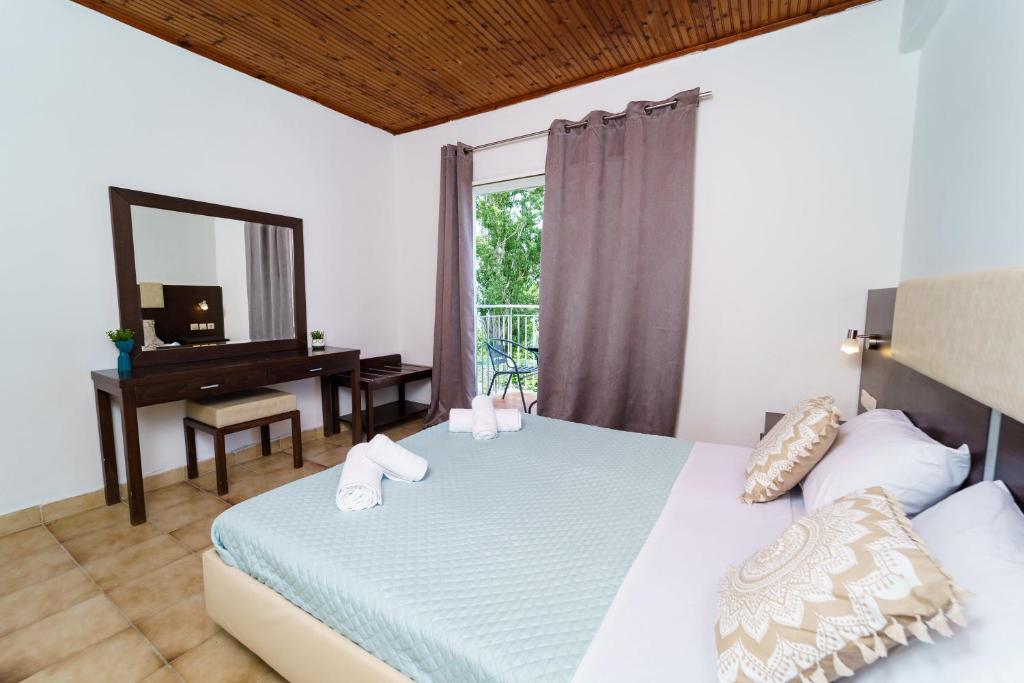 Postel nebo postele na pokoji v ubytování MaYo Rooms Zakynthos