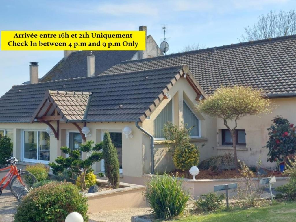 an image of a house with a sign that reads antiseptic centre visit at Logis Hôtel La Rosière in Tracy-sur-Mer