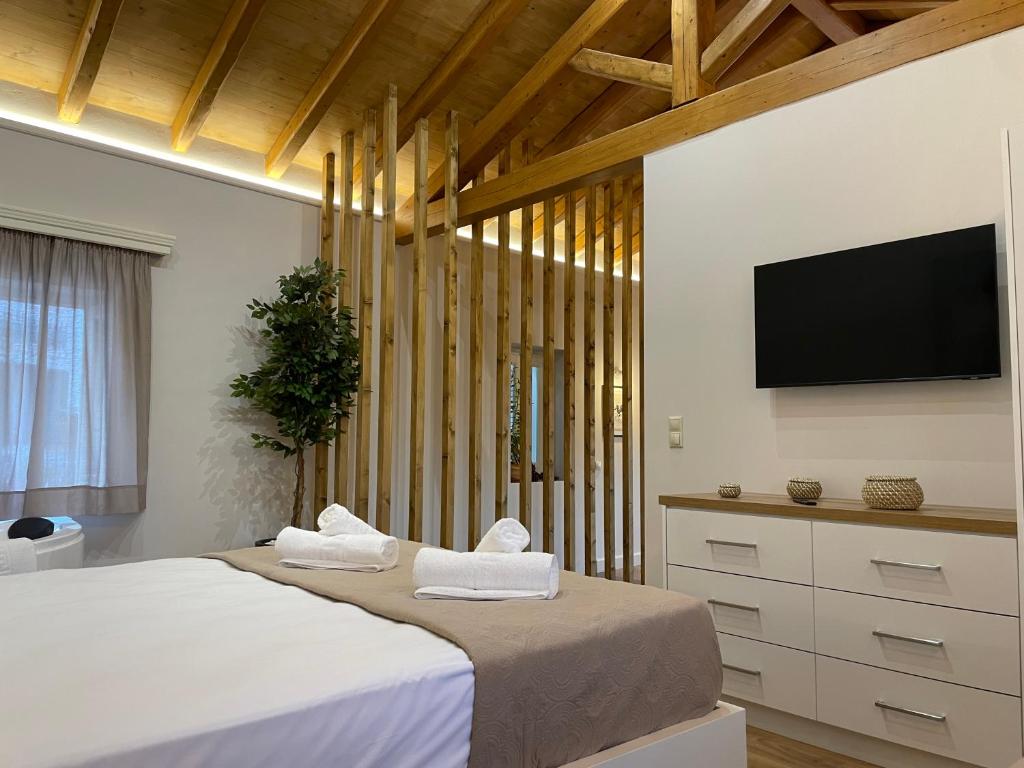 Postel nebo postele na pokoji v ubytování Goninos Jacuzzi Suite