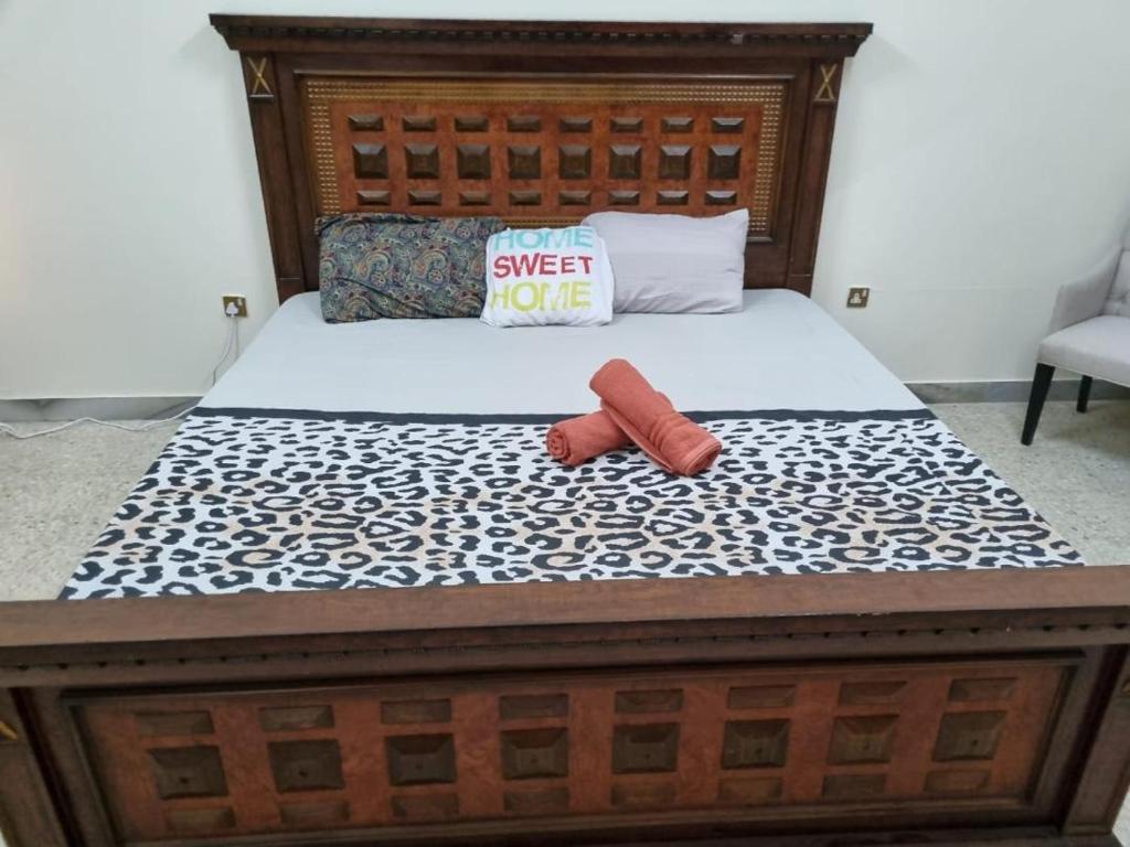 a bed with a sign that reads sweet more at VictoriaS in Al Ain
