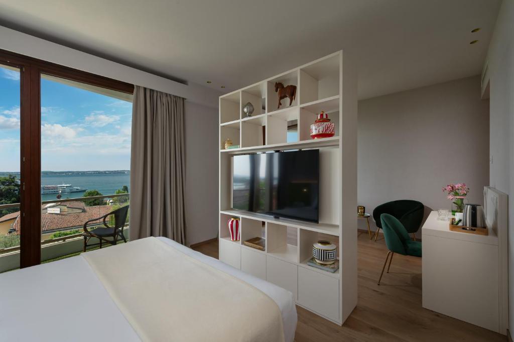 Olivi Hotel & Natural Spaにあるテレビまたはエンターテインメントセンター