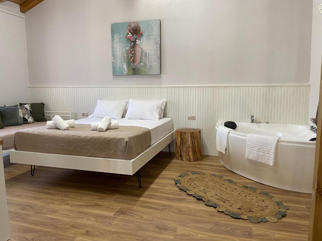 Postel nebo postele na pokoji v ubytování Goninos Jacuzzi Suite