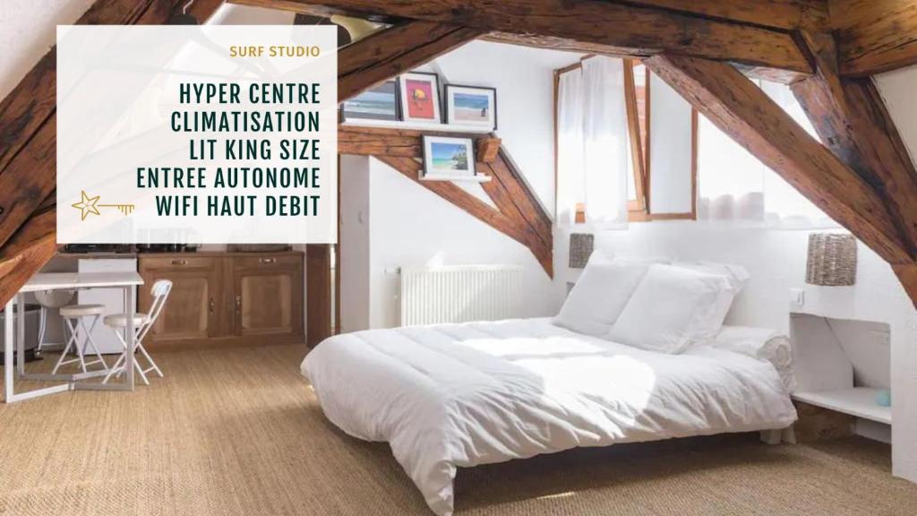 Un pat sau paturi într-o cameră la SURF Studio Lit King Size Maison Alsacienne