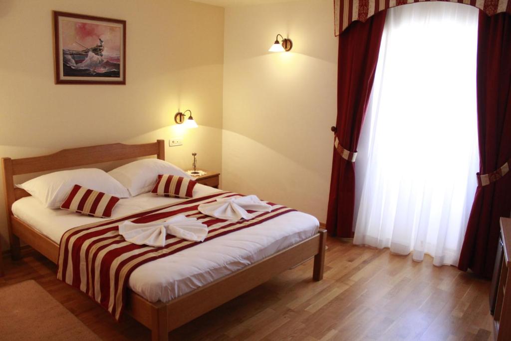 Posteľ alebo postele v izbe v ubytovaní Villa Kula