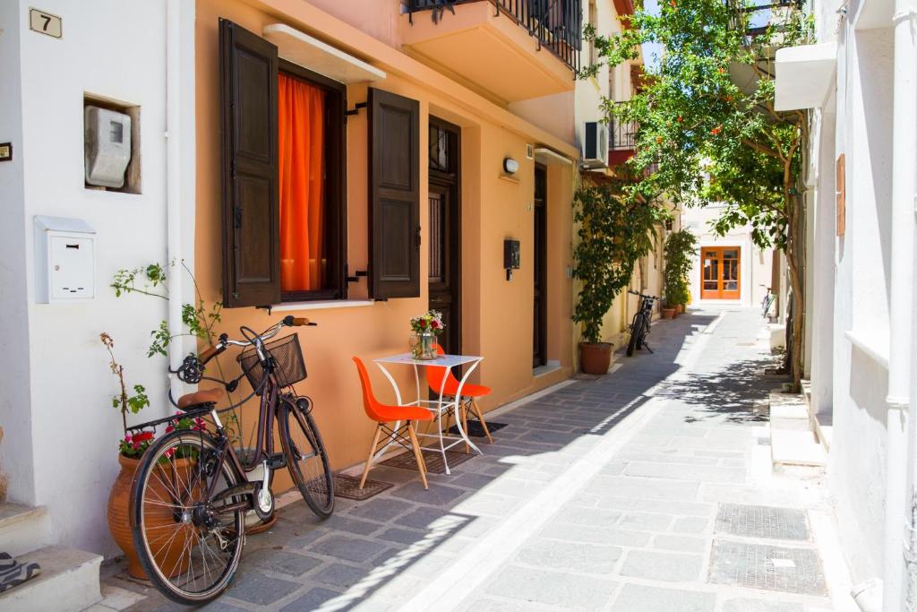 a bike parked on a street in an alley at AC Homes Christos in Rethymno Town