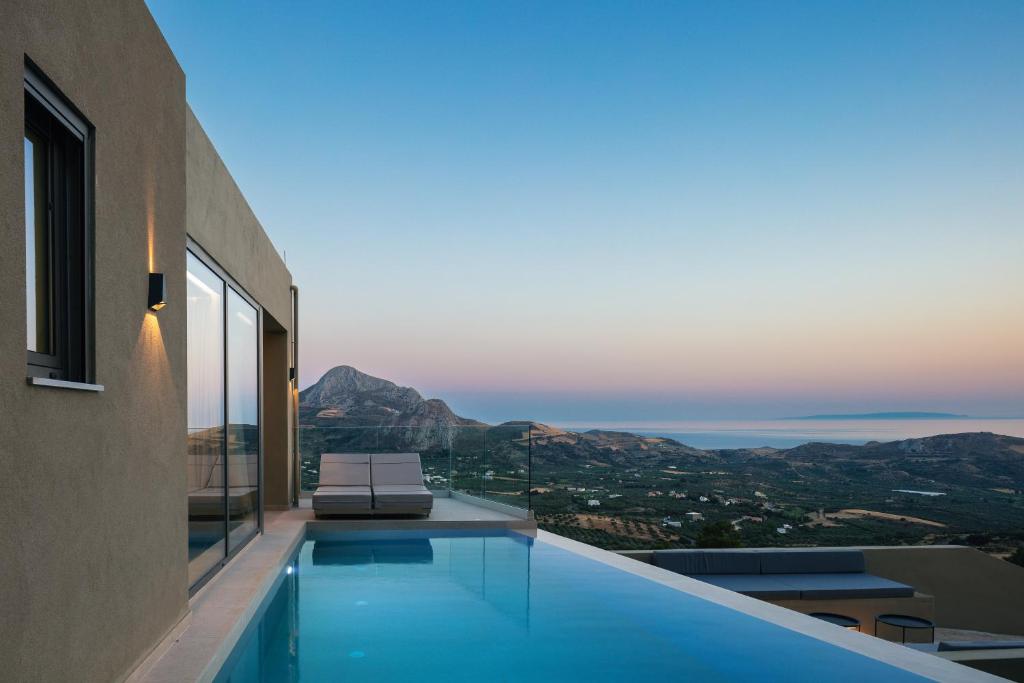 a swimming pool in a house with a view at Epsilon Villa, Private Swimming Pool Garden, Panoramic Sunset in Rethymno