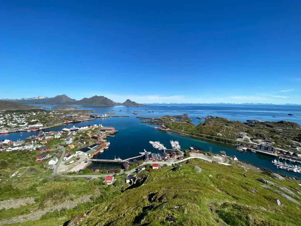 an aerial view of a marina in a lake at Real fisherman's cabins in Ballstad, Lofoten in Ballstad
