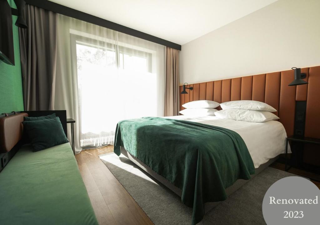 Postel nebo postele na pokoji v ubytování Hotel Astoria Superior