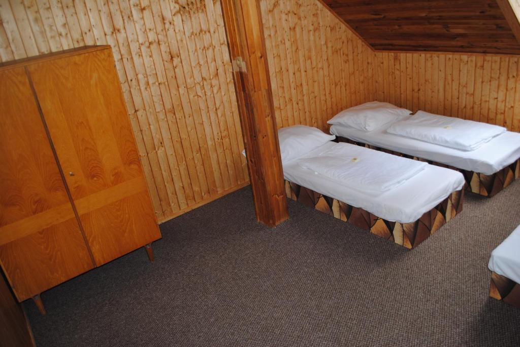 Postel nebo postele na pokoji v ubytování Penzion a Restaurace Kamínek
