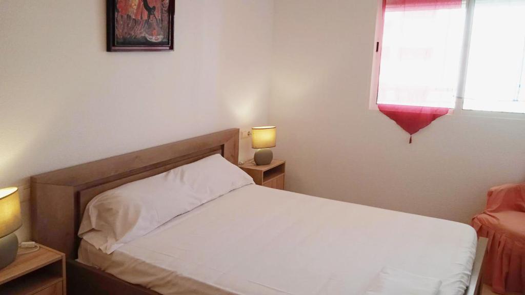 Postel nebo postele na pokoji v ubytování Apartamentos Capricho 3000
