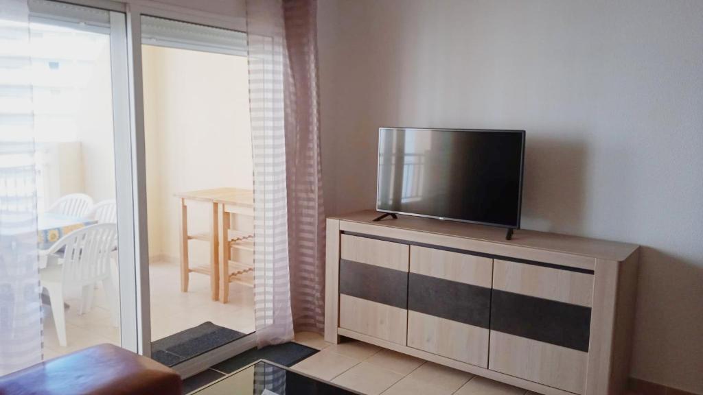 TV a/nebo společenská místnost v ubytování Apartamentos Capricho 3000