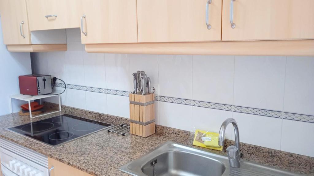Kuchyň nebo kuchyňský kout v ubytování Apartamentos Capricho 3000