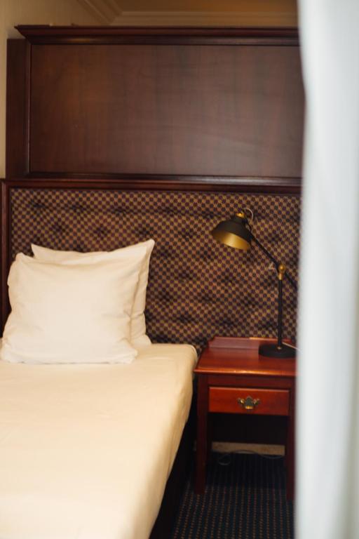 Postel nebo postele na pokoji v ubytování Boutique Hotel De Doelen