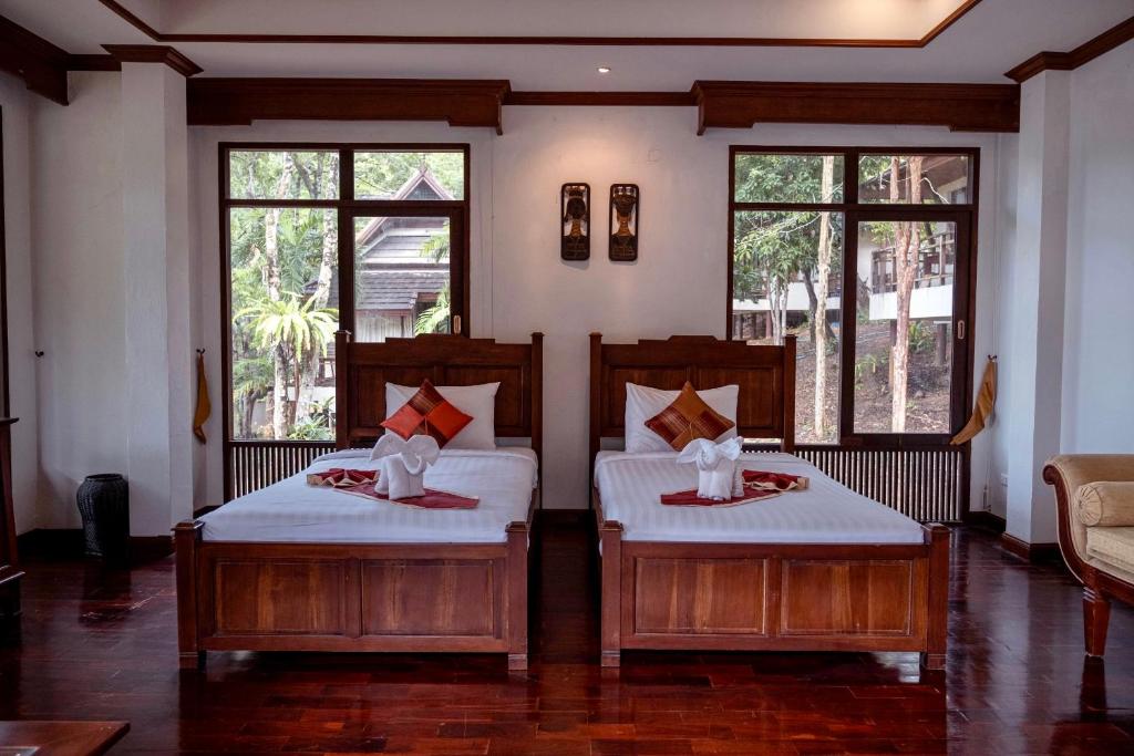Postel nebo postele na pokoji v ubytování Kooncharaburi Resort - Koh Chang