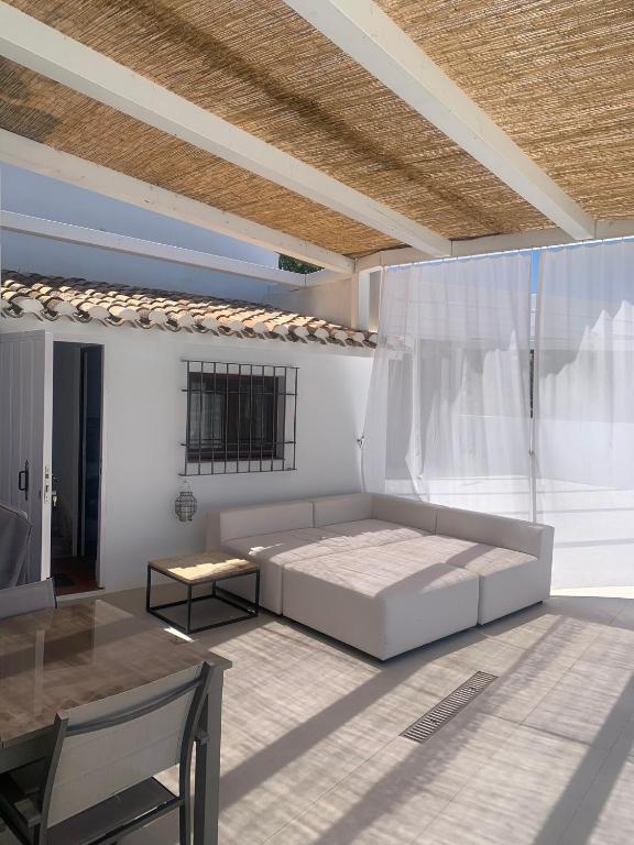 a bedroom with a large bed and a table at Casa Genilla in Priego de Córdoba