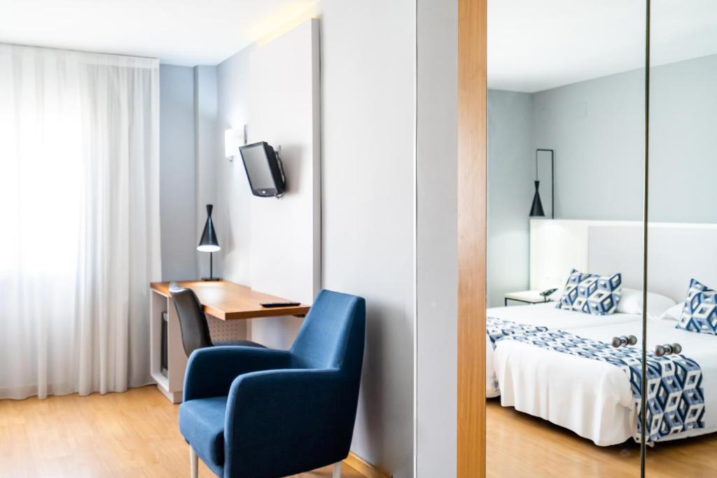 Postel nebo postele na pokoji v ubytování Hotel Beleret